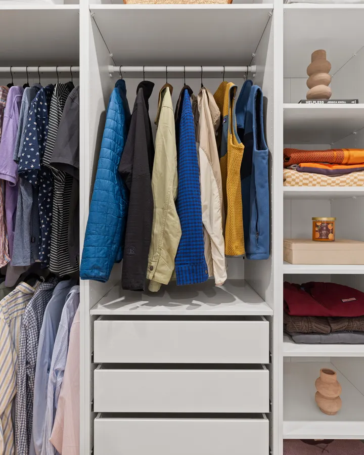 After: the walk-in closet, storage wall to wall